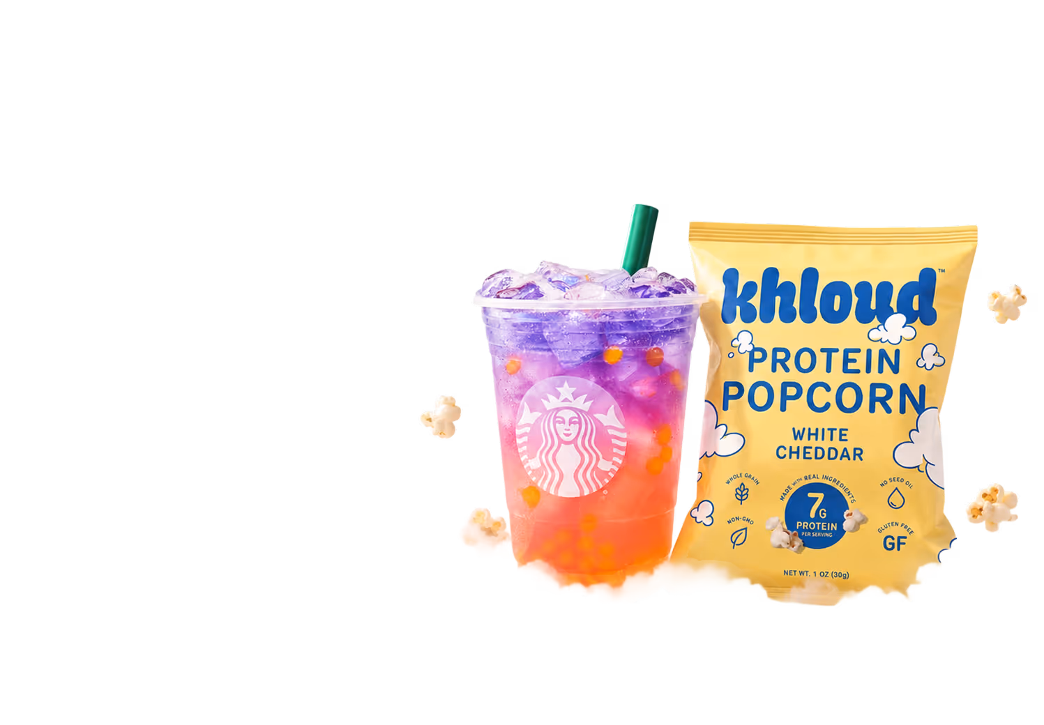 Starbucks Butterfly refresher drink sitting on a cloud in the sky next to Khloud Protein Popcorn White Cheddar in a 1oz bag, surrounded by floating pieces of popcorn